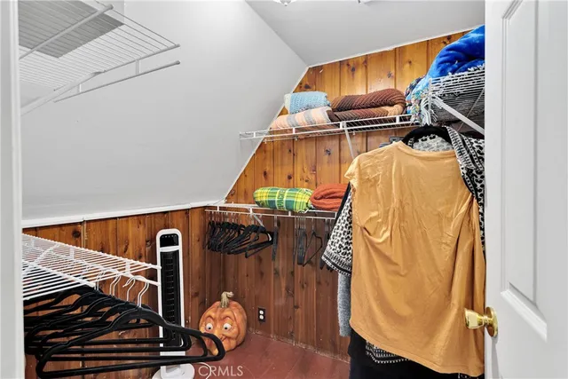 a bathroom with a toilet and a shower curtain