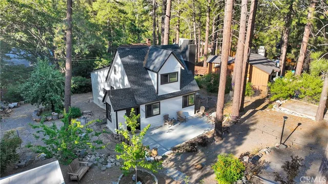 a front view of a house with trees