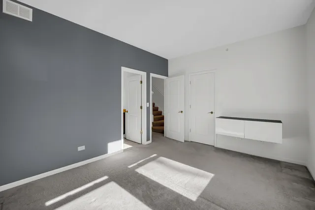 a bathroom with a double vanity sink mirror and toilet