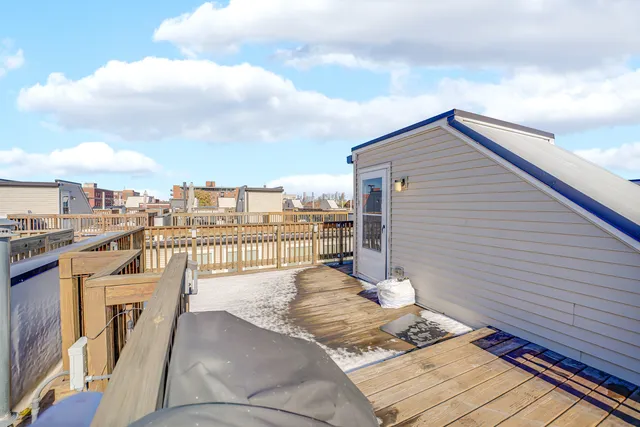 a living room with a large window and a couch