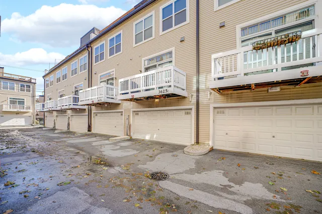 a view of kitchen with granite countertop a stove a sink and a window