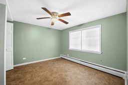 9209 South State Street Chicago, IL 60619 - Photo 12 of 20 an empty room with ceiling fan and window