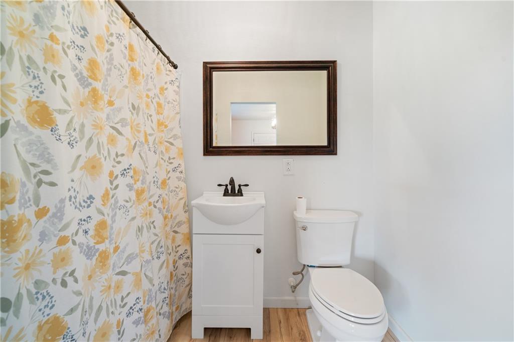 315 Woody Road Northwest Adairsville, GA 30103 - Photo 14 of 50 a bathroom with a toilet and a sink