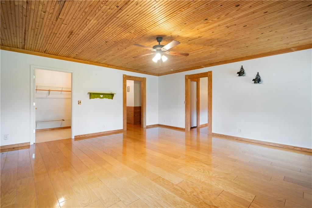 315 Woody Road Northwest Adairsville, GA 30103 - Photo 18 of 50 a view of an empty room with window and wooden floor