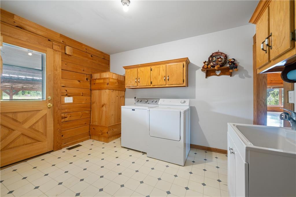315 Woody Road Northwest Adairsville, GA 30103 - Photo 22 of 50 a bathroom with a sink a vanity and a window