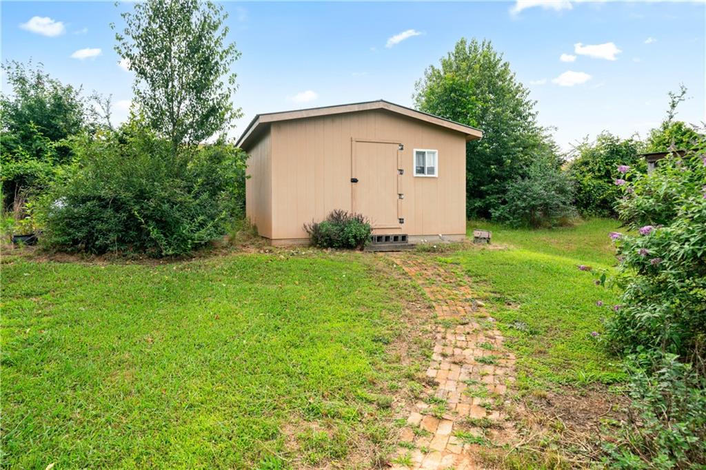 315 Woody Road Northwest Adairsville, GA 30103 - Photo 31 of 50 a view of an house with backyard space and garden
