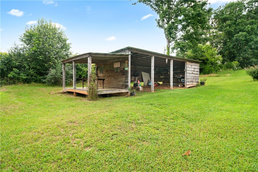 315 Woody Road Northwest Adairsville, GA 30103 - Photo 32 of 50 a view of a house with backyard and porch