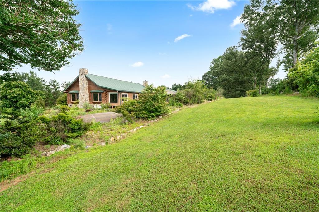 315 Woody Road Northwest Adairsville, GA 30103 - Photo 40 of 42 a view of a large garden with plants and large trees