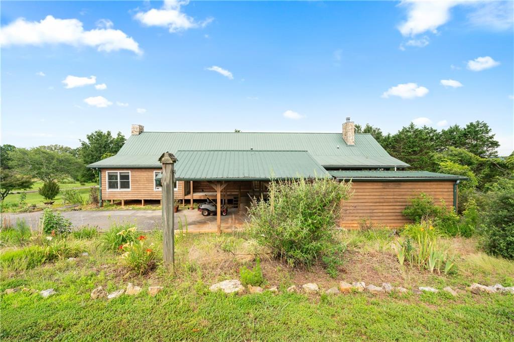315 Woody Road Northwest Adairsville, GA 30103 - Photo 41 of 42 a house view with a garden space
