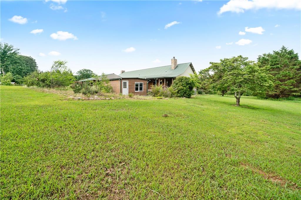 315 Woody Road Northwest Adairsville, GA 30103 - Photo 42 of 42 a view of a big yard with a house in the background