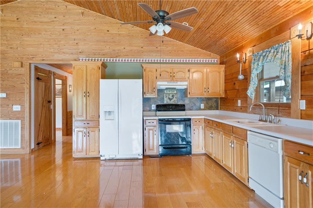 315 Woody Road Northwest Adairsville, GA 30103 - Photo 10 of 50 a kitchen with stainless steel appliances granite countertop a sink and cabinets