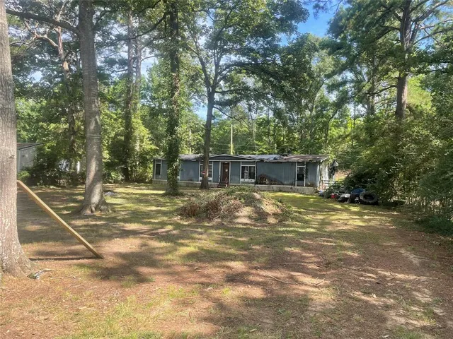 a view of a house with basketball court
