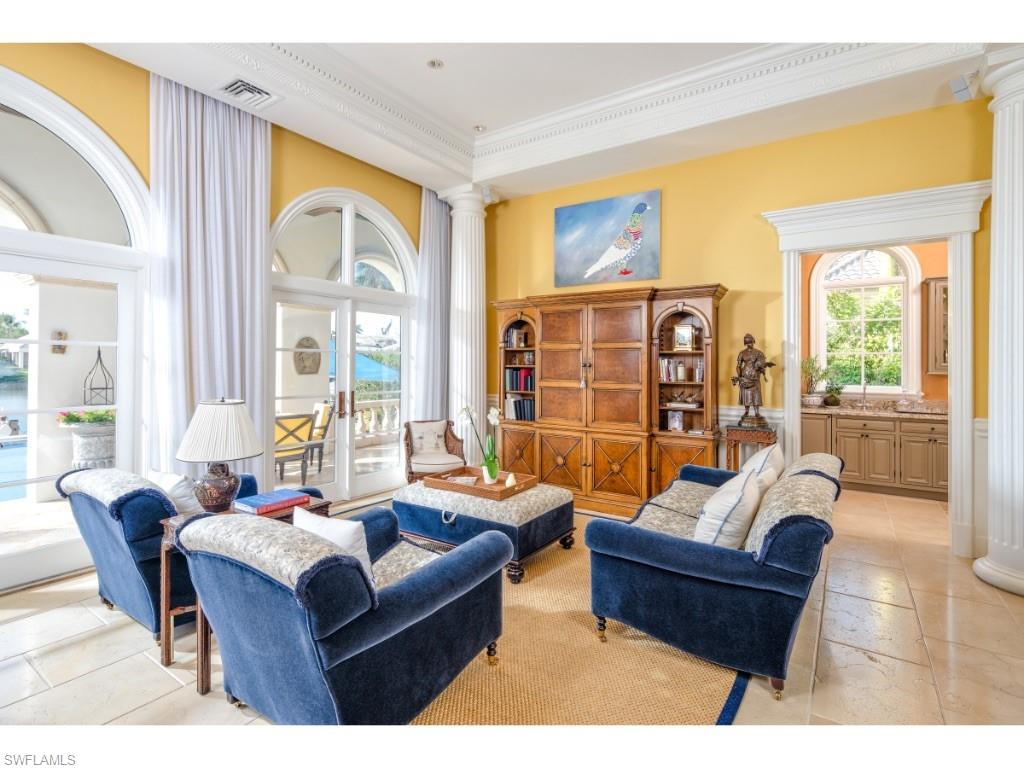 3600 Rum Row Naples, FL 34102 - Photo 11 of 20 a living room with furniture and a large window