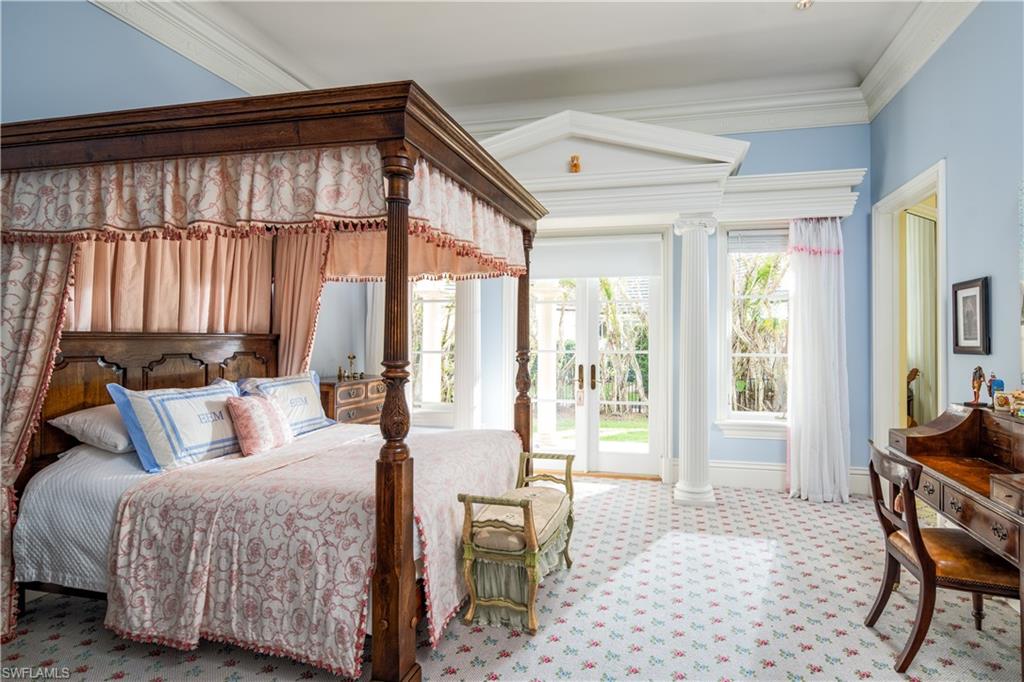 3600 Rum Row Naples, FL 34102 - Photo 13 of 20 a bedroom with a bed and a window