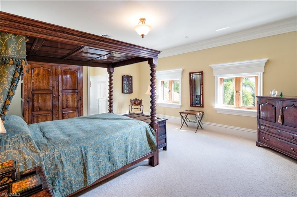 3600 Rum Row Naples, FL 34102 - Photo 15 of 20 a bedroom with a bed next to a window