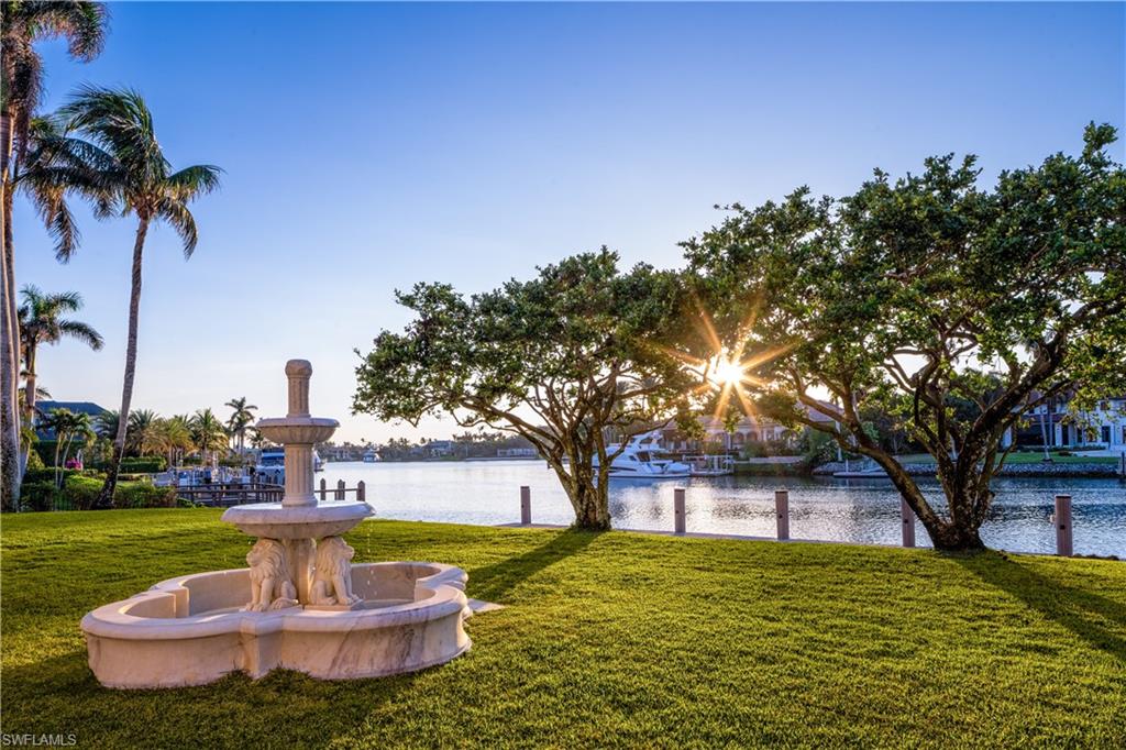 3600 Rum Row Naples, FL 34102 - Photo 19 of 20 a front view of a house with a yard