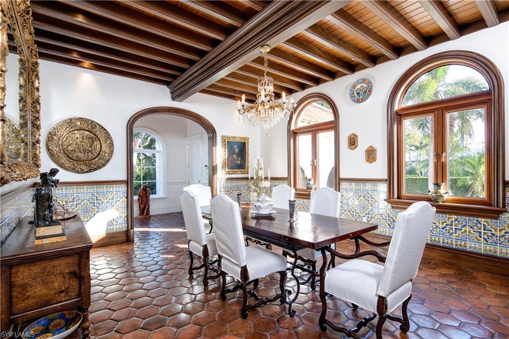 3600 Rum Row Naples, FL 34102 - Photo 6 of 20 a view of a dining room with furniture window and wooden floor