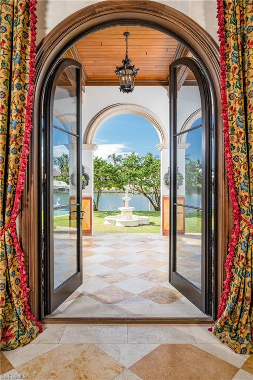 3600 Rum Row Naples, FL 34102 - Photo 9 of 20 a view of a entryway door of the house
