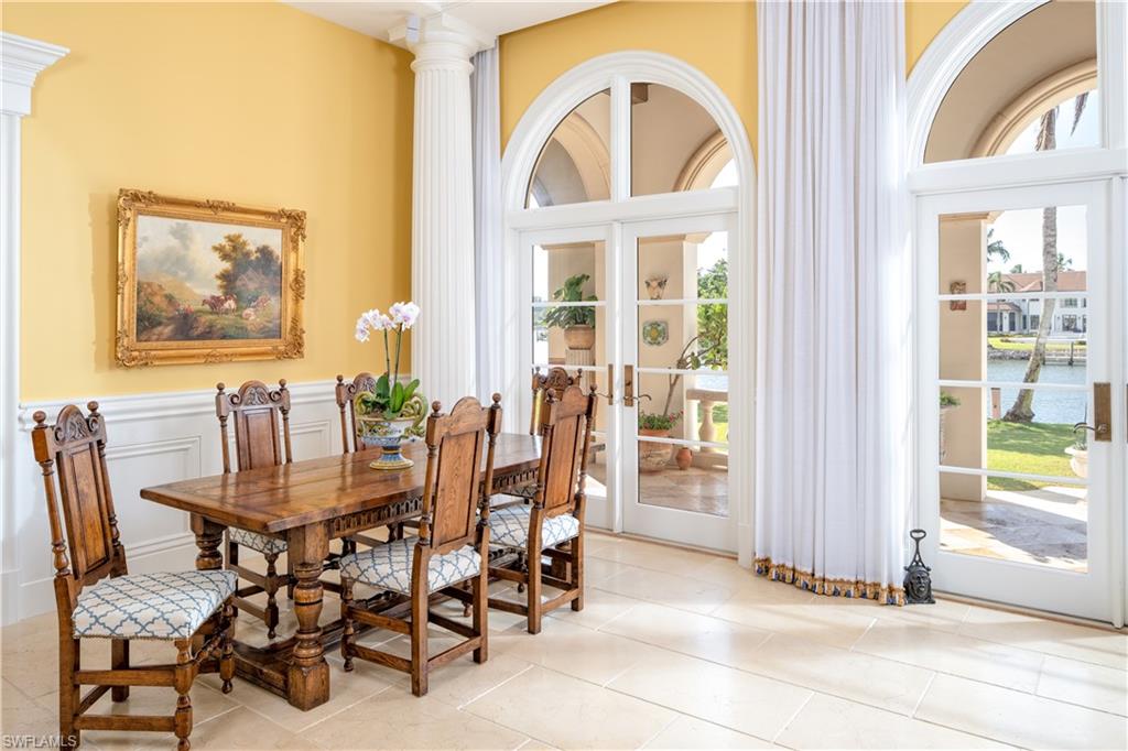 3600 Rum Row Naples, FL 34102 - Photo 10 of 20 a view of a dining room with furniture and a window