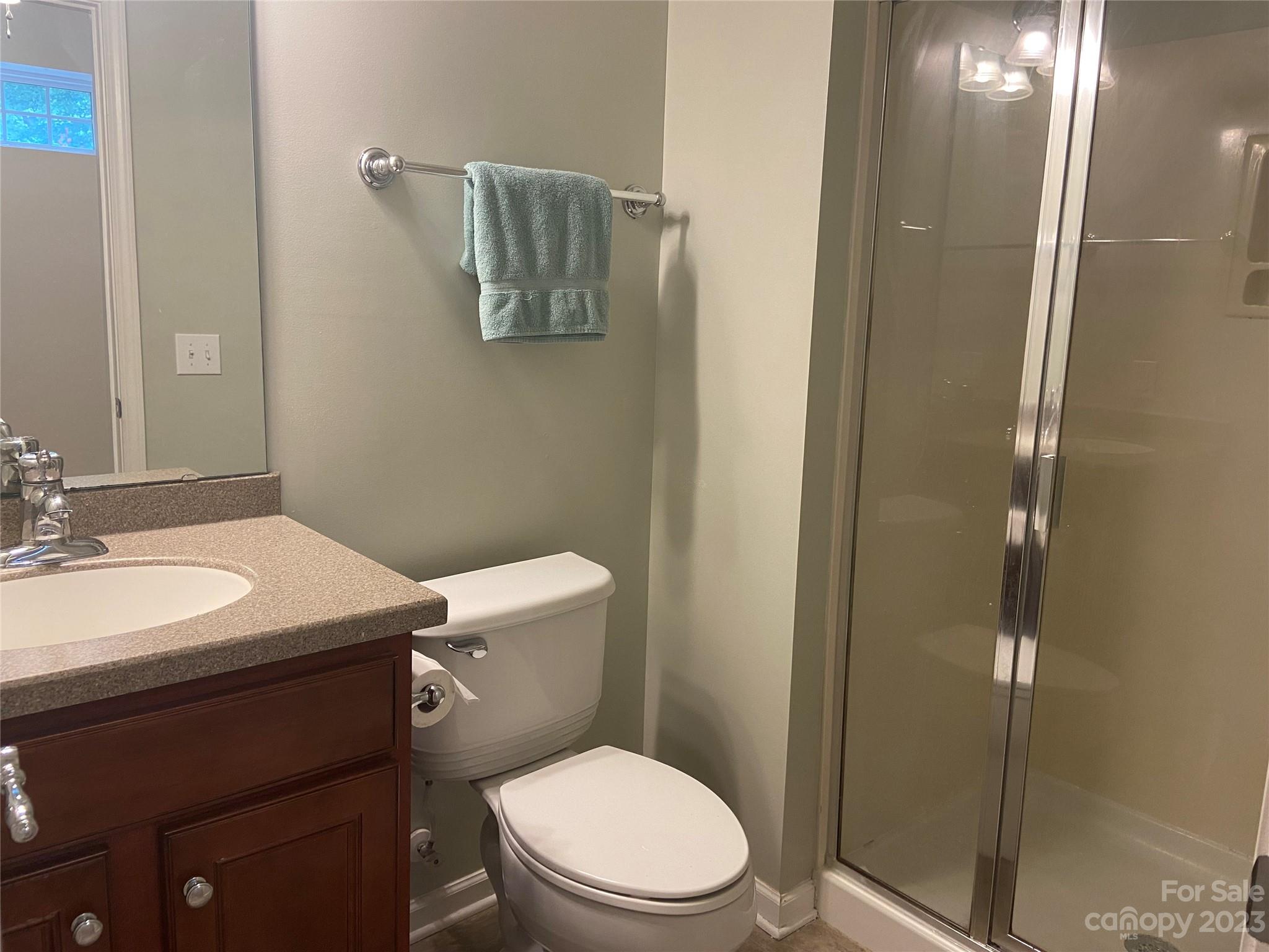 724 Passage Drive Fort Mill, SC 29708 - Photo 19 of 20 a bathroom with a toilet a sink and shower