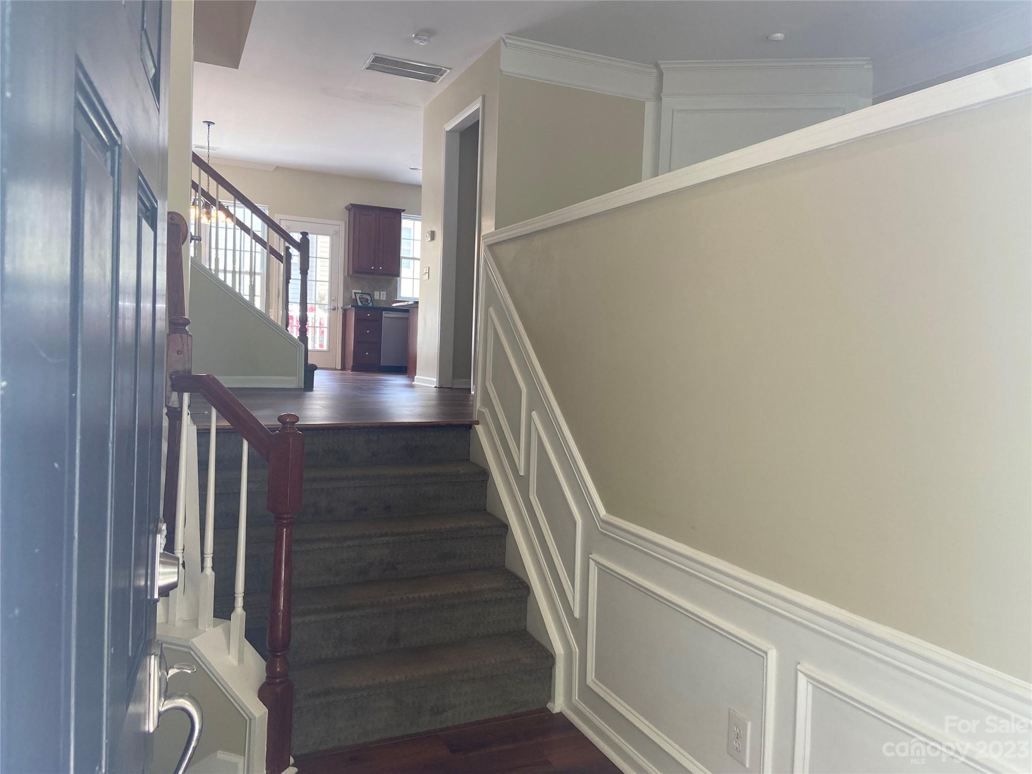 724 Passage Drive Fort Mill, SC 29708 - Photo 3 of 20 a view of staircase with lots of frames on wall and a window