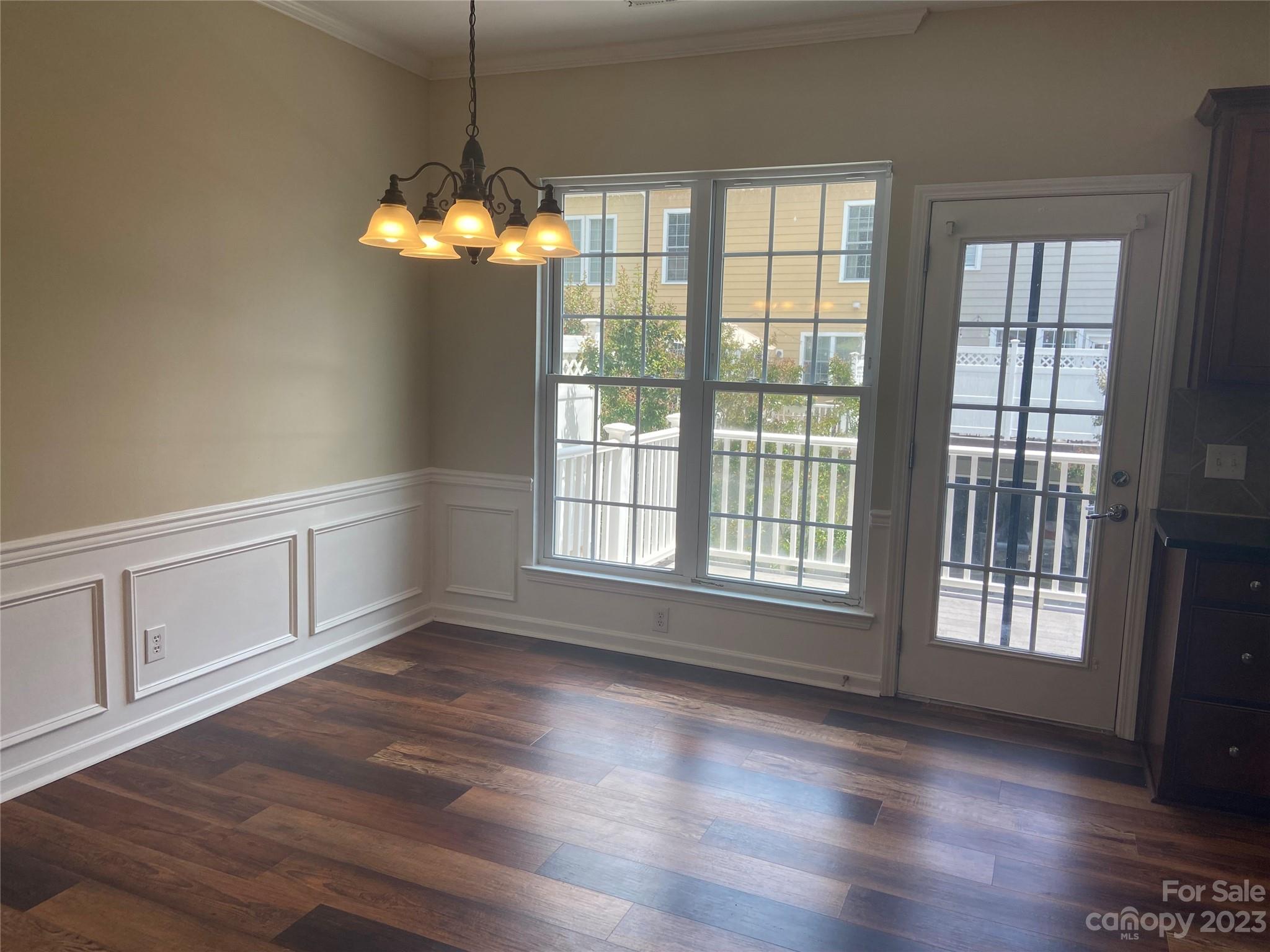 724 Passage Drive Fort Mill, SC 29708 - Photo 7 of 20 a view of a room with wooden floor and chandelier