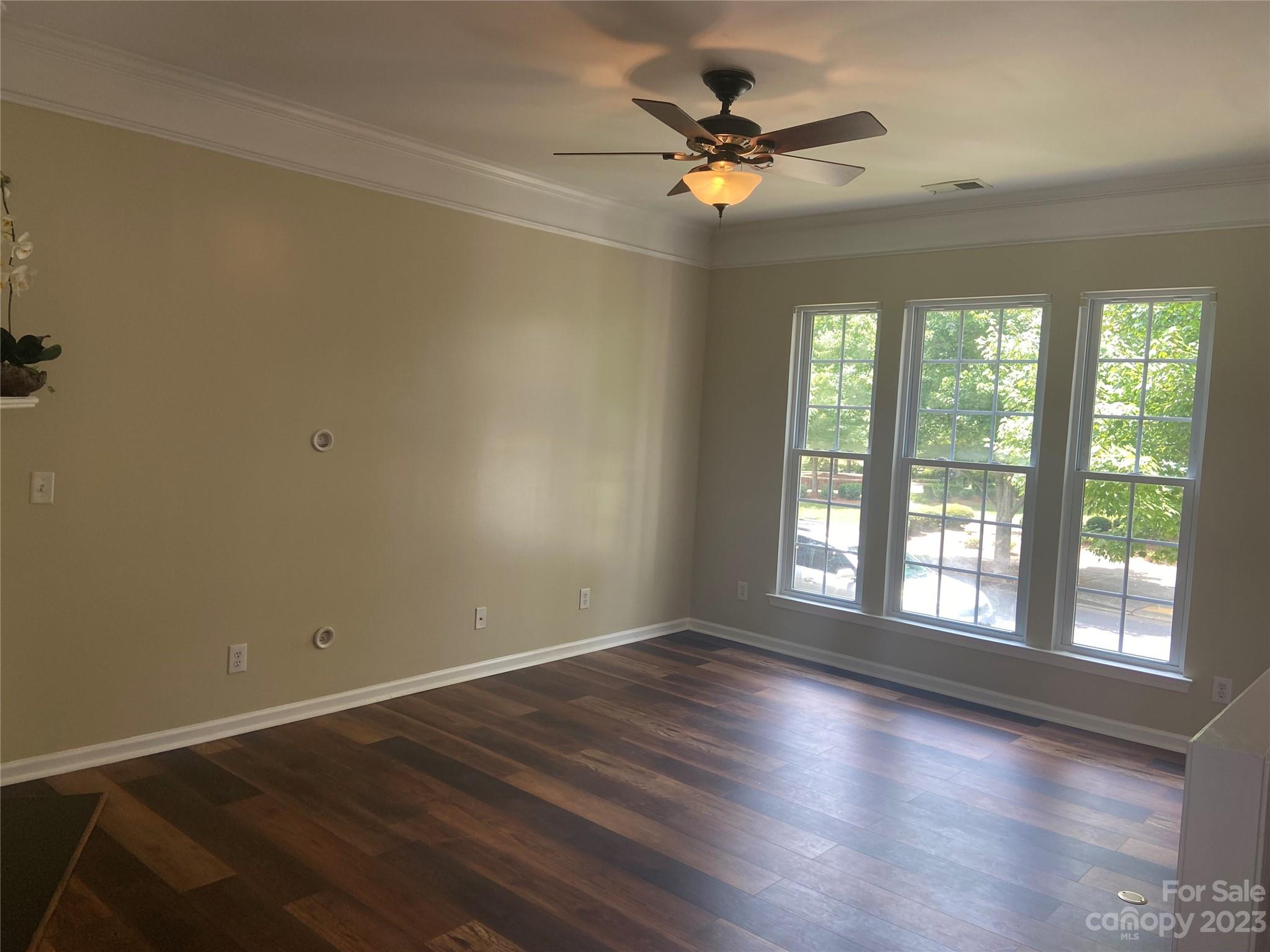 724 Passage Drive Fort Mill, SC 29708 - Photo 9 of 20 a view of an empty room with wooden floor and a window