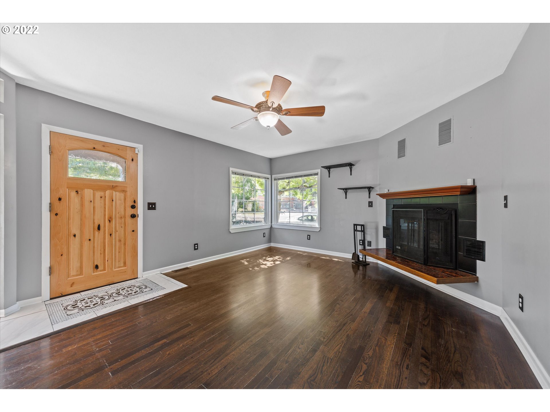 3200 R Street Vancouver, WA 98663 - Photo 5 of 32 a view of an empty room with a window and wooden floor