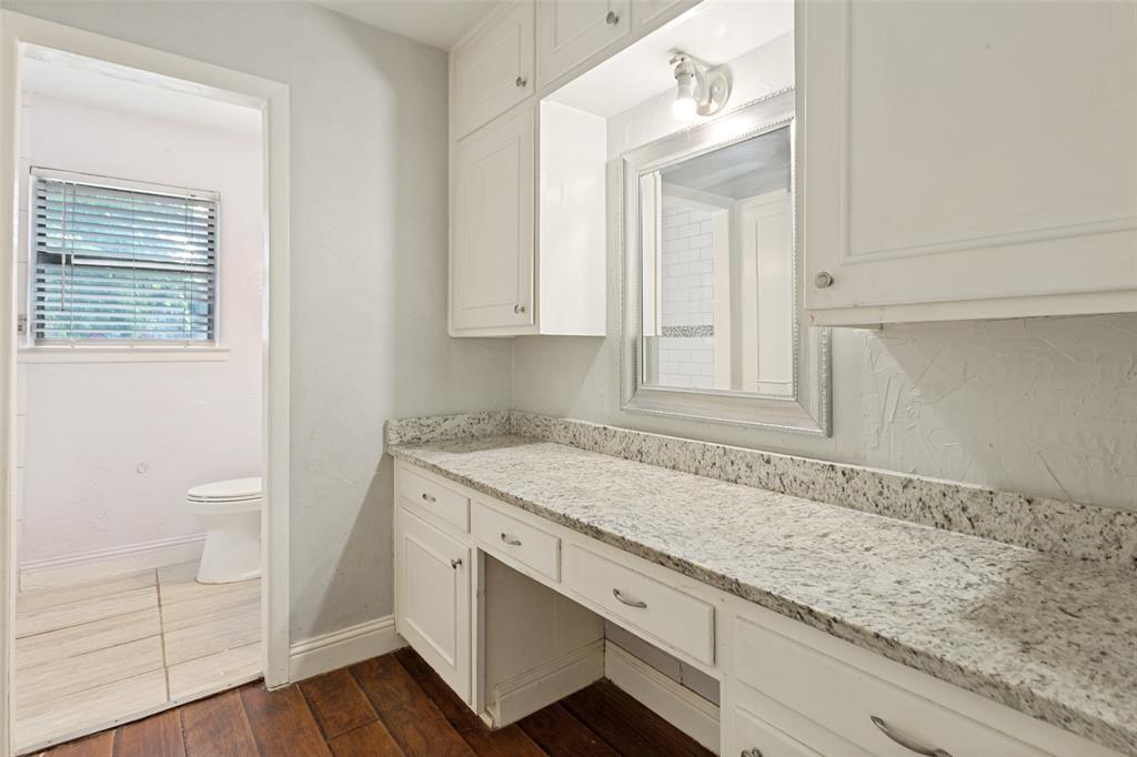 1904 Old Kirk Road Bedford, TX 76022 - Photo 18 of 25 a view of a kitchen sink and cabinets