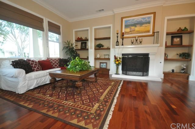 2 Calliandra Street Ladera Ranch, CA 92694 - Photo 1 of 1 Living room features fireplace and warm wood floors