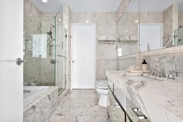 a bathroom with a sink and shower