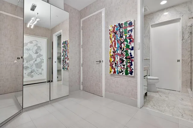 a view of a bathroom with a shower and a toilet