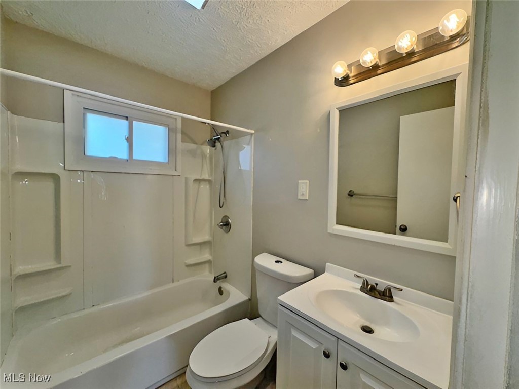 28642 Forest Road Willowick, OH 44095 - Photo 16 of 23 Full bath with a textured ceiling, vanity, and shower combination