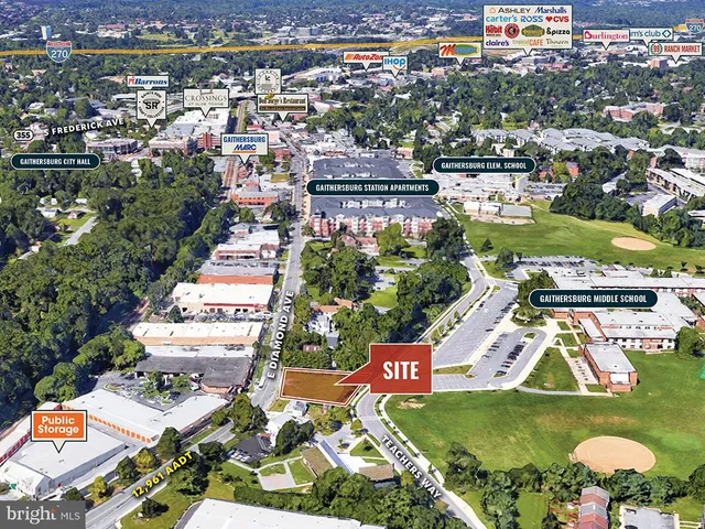 an aerial view of residential houses with outdoor space and swimming pool