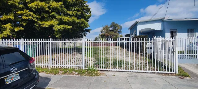 a view of a wrought iron fences in front of house