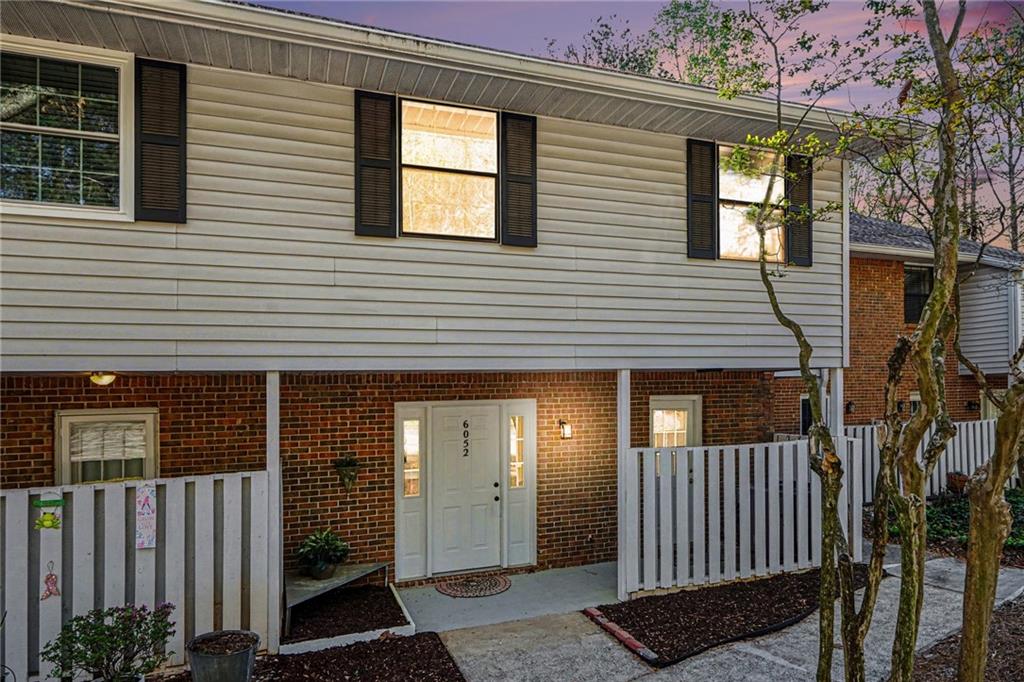 6052 WinterGreen Road Northwest Norcross, GA 30093 - Photo 24 of 24 a view of a house with wooden fence