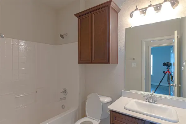 a view of a bathroom from a hallway