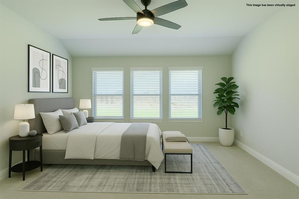 616 England Street Fate, TX 75189 - Photo 17 of 40 Visual staged Bedroom with light carpet, vaulted ceiling, and ceiling fan