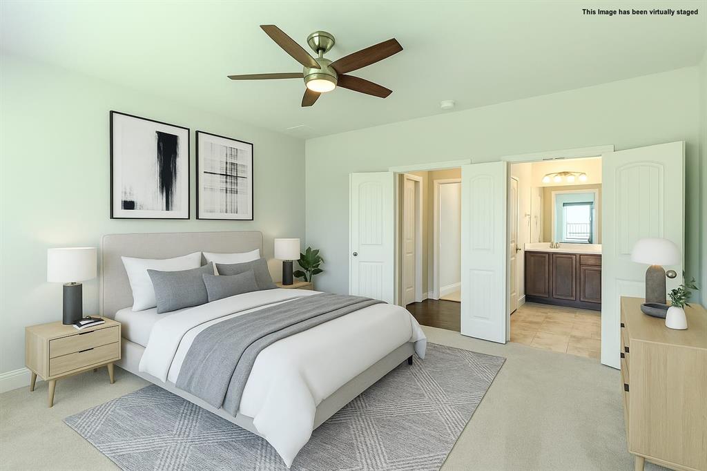 616 England Street Fate, TX 75189 - Photo 23 of 40 Visual staged Master Bedroom with light colored carpet, connected bathroom, and ceiling fan