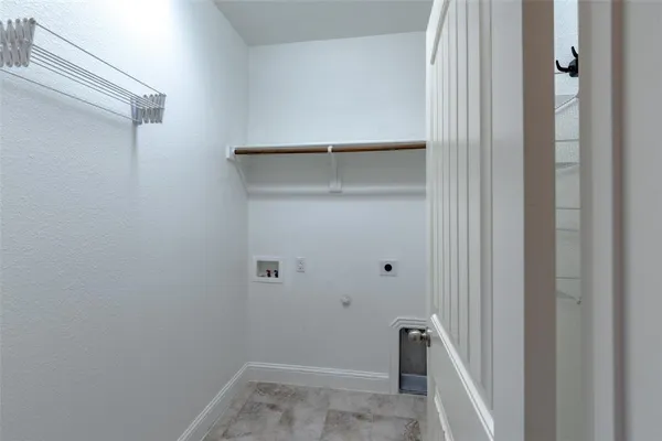 a view of a storage and utility room with closet
