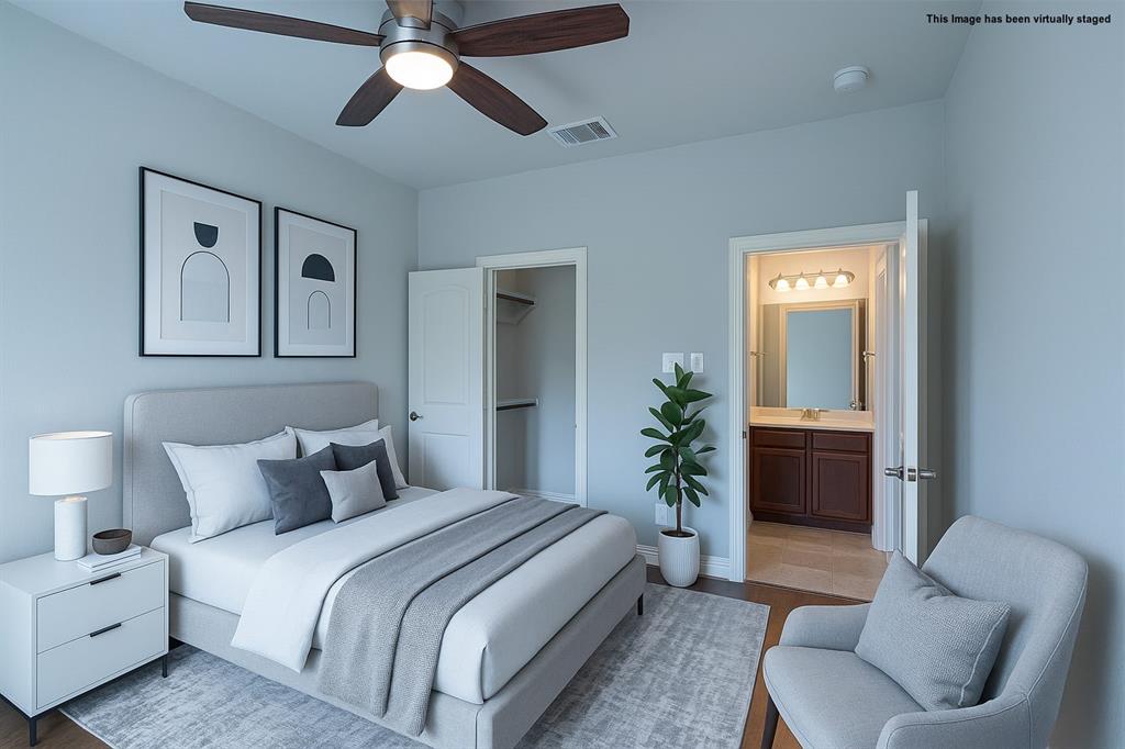616 England Street Fate, TX 75189 - Photo 28 of 40 Visual staged Bedroom #3 featuring a spacious closet, a ceiling fan, wood finished floors, and ensuite bath