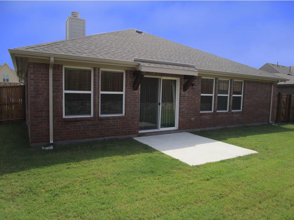 616 England Street Fate, TX 75189 - Photo 34 of 40 Rear view of property with a patio area, a fenced backyard, brick siding, and a shingled roof