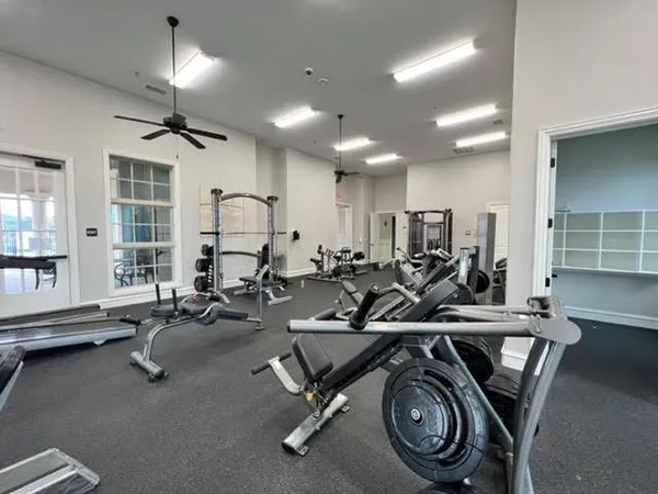 a view of a swimming pool with outdoor seating