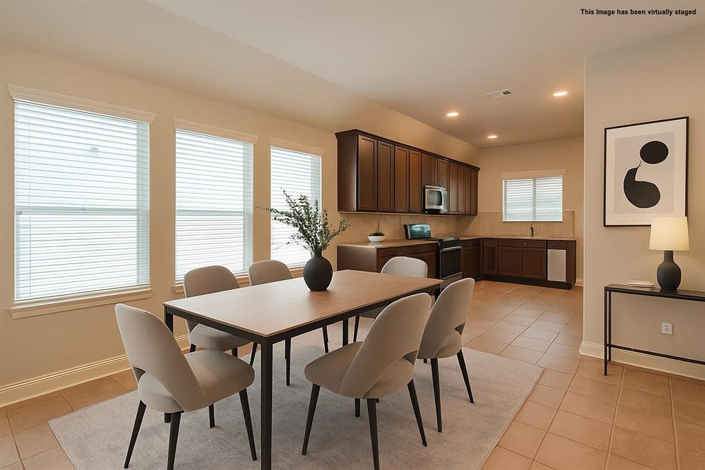 616 England Street Fate, TX 75189 - Photo 3 of 40 Visual staged Dining area featuring light tile patterned flooring and recessed lighting