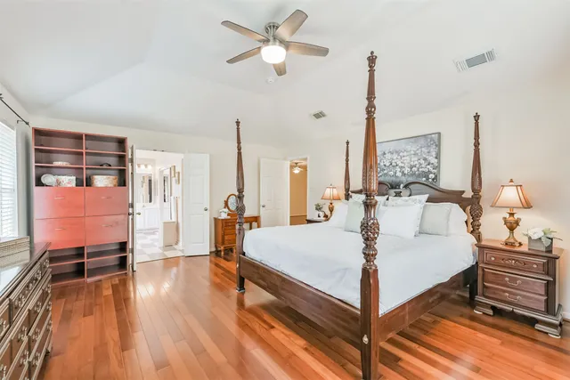 a large white bed in a white room