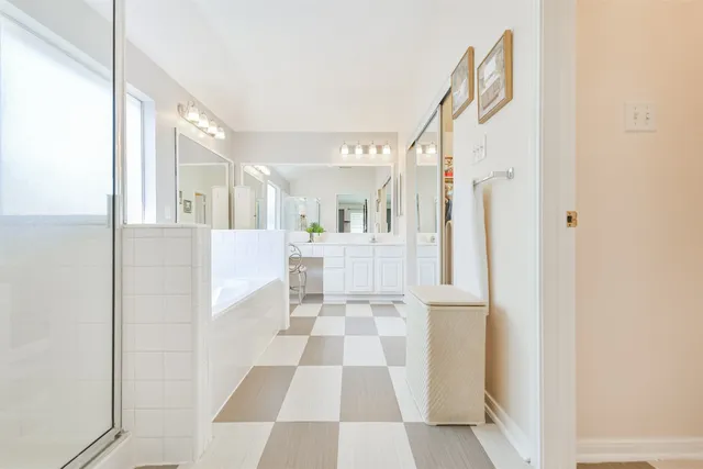 a utility room with cabinets washer and dryer