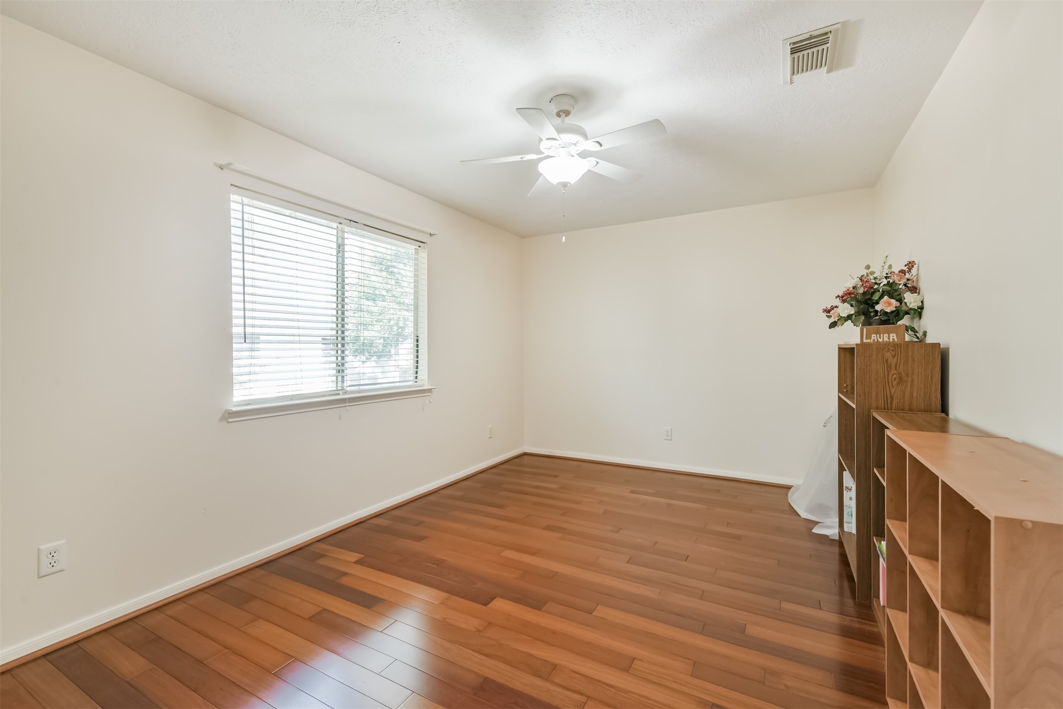 9206 Memorial Hills Drive Spring, TX 77379 - Photo 34 of 50 a view of an empty room with a window and wooden floor