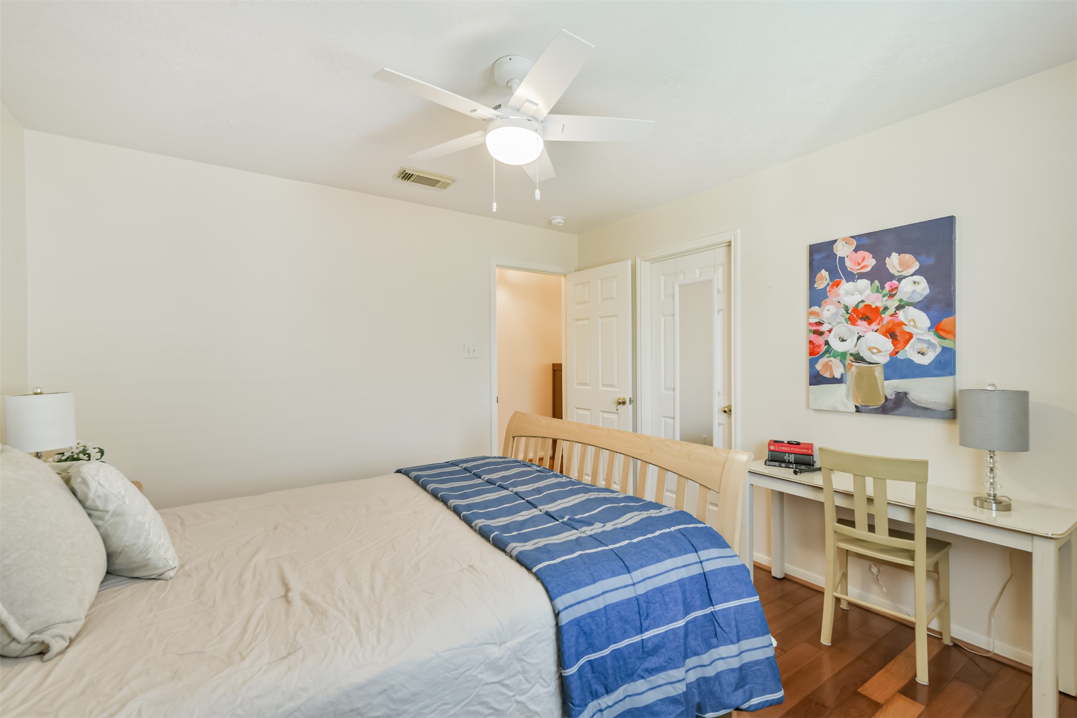 9206 Memorial Hills Drive Spring, TX 77379 - Photo 36 of 50 a bedroom with a bed and a bookshelf