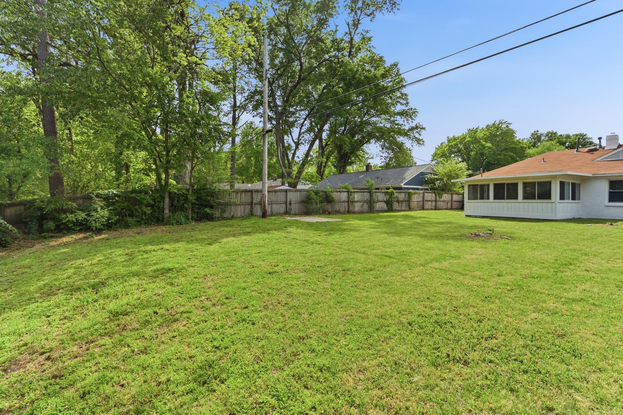 312 Fernway Road Memphis, TN 38117 - Photo 33 of 38 Fenced backyard featuring a sunroom