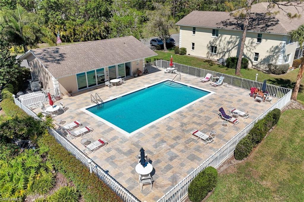 280 Timber Lake Circle, Unit H201 Naples, FL 34104 - Photo 31 of 33 an aerial view of a house with outdoor space